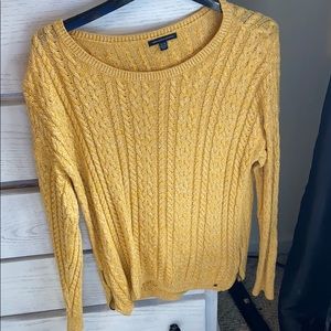 Gold long sleeve sweater.